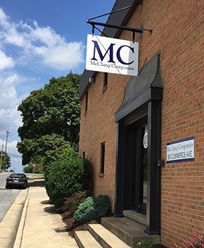 McClung front door and sign as seen from sidewalk.