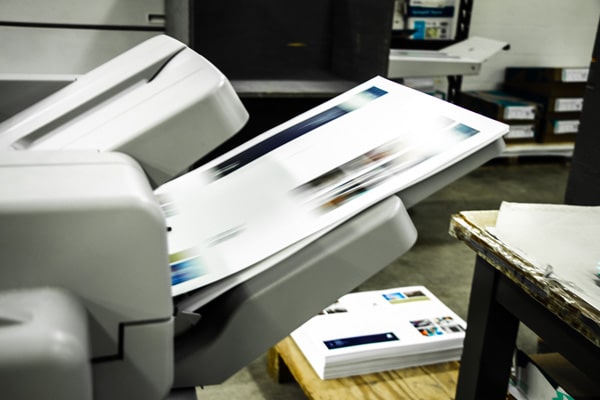A photo copier in the process of printing a copy.